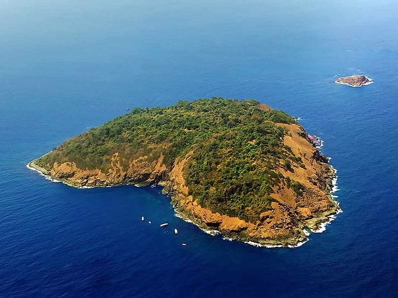 Aerial view of the heart-shaped Netrani Island in the blue sea