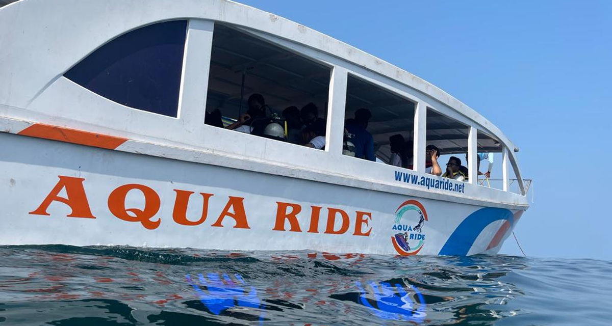 Aqua Ride tourist boat filled with passengers at sea